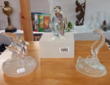 A Swarovski penguin & 2 glass figures of a seahorse of dolphins