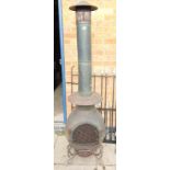 An old outdoor cast woodburner with grille etc 1.8M (H)