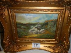 A gilt framed country scene with shepherd and sheep, 30 x 25 cm.