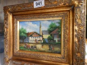 A gilt framed village scene signed S Rourk. COLLECT ONLY.