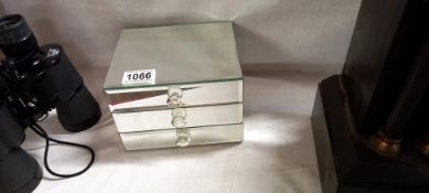 A mirrored glass 3 drawer jewellery box chest of drawers