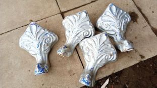 A set of 4 cast decorative bath feet