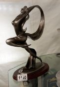 A silvered resin figurine of a Art Deco lady