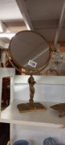 A vintage brass shaving mirror with cherub base (Height 40cm x Diameter 21cm) COLLECT ONLY