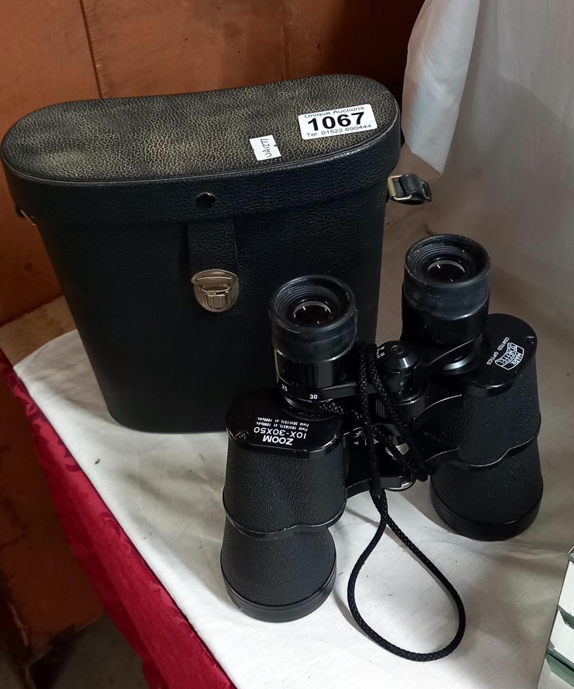 A cased pair of binoculars.