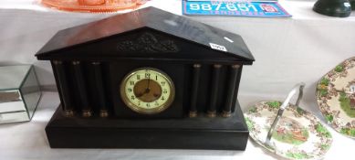 A heavy slate Palladian style mantle clock, COLLECT ONLY.