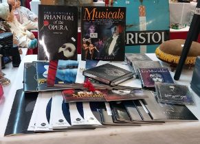 A quantity of Les miserables Phantom of the opera programmes and CD's etc.