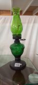 A retro green glass & metal oil lamp