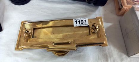 An Edwardian brass letter box door knocker RD No. 642366