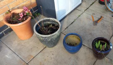 A terracotta planter & 3 other ceramic pots