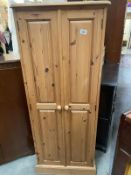 A pine 2 door cupboard (61cm x 34cm x 153cm) COLLECT ONLY