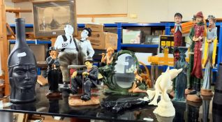 A selection of resin & ceramic figures including Laurel & Hardy etc.