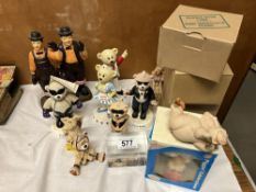 A quantity of resin figures including moles, bears, pigs & A Laura & Hardy ceramic