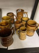 Collection of 9 Stone ware tankards