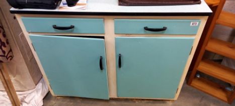 A vintage kitchen cupboard unit with Formica top