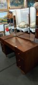 A mid century teak dressing table, Thin pedestals with 3 drawers each, Another drawer & 3 with