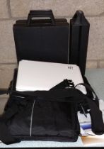 An EEE Pc 100H with headphones & Remote