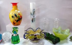 A selection of vintage coloured art glass including scene bottle vases etc