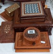 A good varied selection of wooden trinket boxes including inlaid & carved
