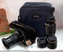 A Praktica BC 1 35mm camera with lenses