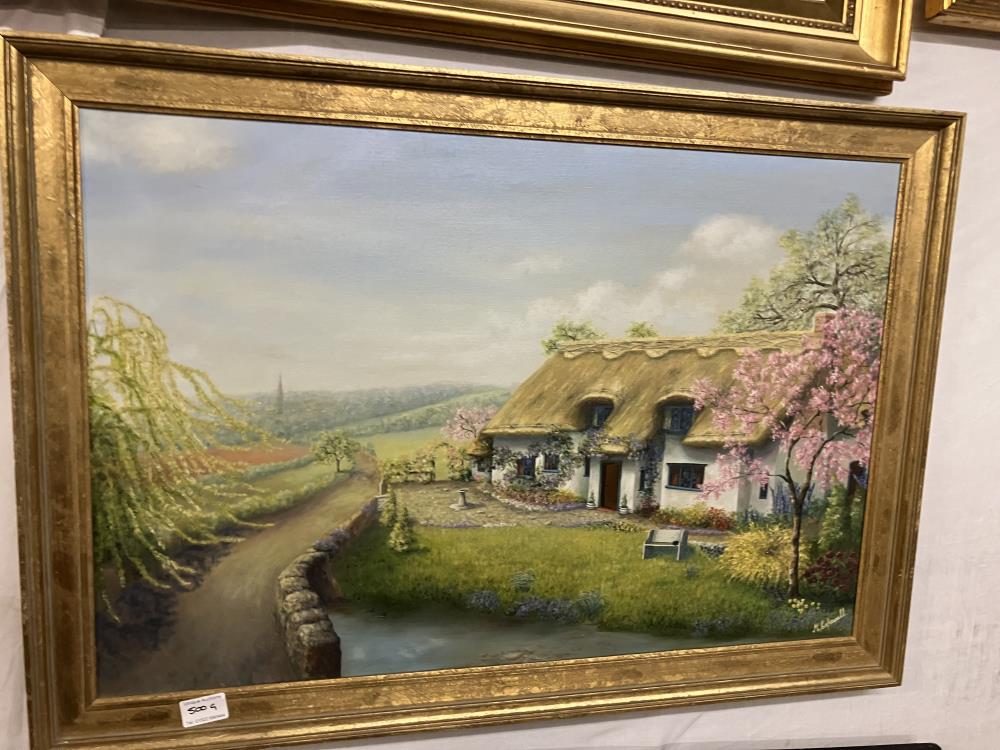 An Oil on canvas Thatched cottage signed M Capewell