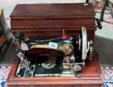 A cased Singer sewing machine COLLECT ONLY