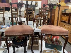 A pair of ornately carved hall chairs COLLECT ONLY