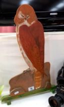 A large painted wooden cut out of a bird of prey Height 54cm