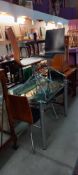 An extending glass top kitchen table & 4 chairs COLLECT ONLY
