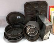 A quantity of vintage tin bakery ware