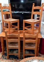 A pine dining table & 4 rush seated chairs COLLECT ONLY