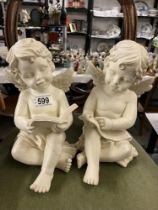 A pair of resin Cherub figures