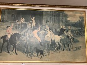 A large gilt coloured framed hunting print