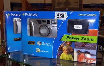 2 boxed Polaroid cameras