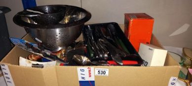 A box of miscellaneous items including kitchenalia