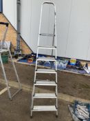A tall pair of aluminium step ladders