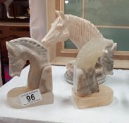 A pair of polished stone horse head book ends & 1 other resin bust on stone