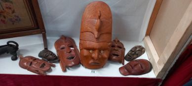 7 Carved wooden tribal face masks