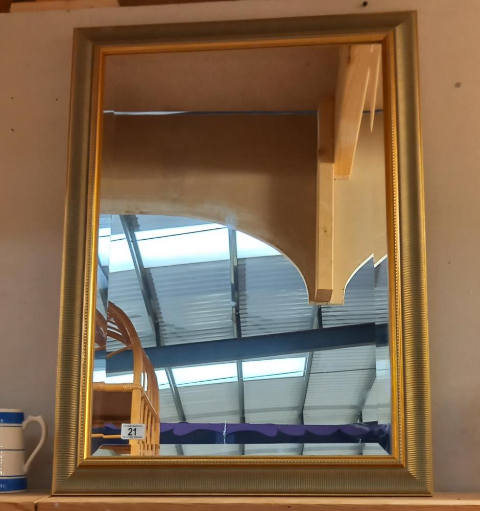 A gilt framed bevel edged mirror, 84cm x 62 cm. COLLECT ONLY