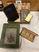 A small tin decorated with stamps & An early 20th century book of common prayer & Minature book of