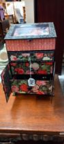 A floral decorated cardboard jewellery box in the form of a cabinet