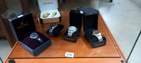A quantity of cased modern gents watches