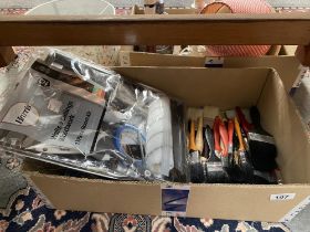 A quantity of paint brushes including a new pack with roller etc.