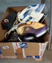 A box of irons including vintage travel irons COLLECT ONLY