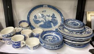 selection of blue and white crockery Cups saucers plates bowls some willow pattern and others