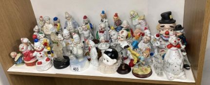 2 shelves of over 60 ceramic and other materials (resib etc) Clowns