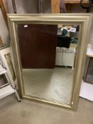 A pale gold coloured mirror