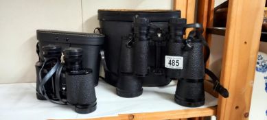 A selection of camera equipment including Minolta maxum spxL, Canon lens, 3 pairs of binoculas
