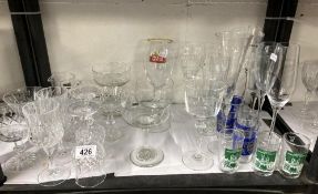 Good selection of drinking glass ware flutes, bowls goblets and Lincoln shot glasses (2 shelves)