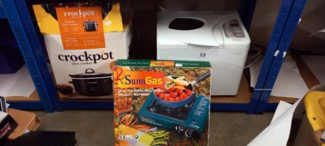 A fryer & boxed crockpot & gas burner